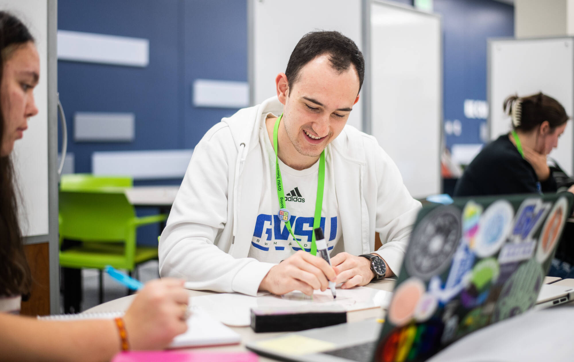 Pablo Kohlmann Garcia, right, tutors Tara Barnett, left, in the new Tutoring and Reading Center in Henry Hall September 27.(Photo releases on file)